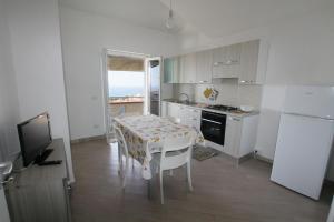 A kitchen or kitchenette at Appartamenti Torre