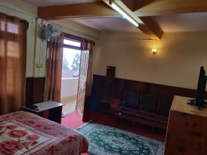 Postel nebo postele na pokoji v ubytování Deki Lodge