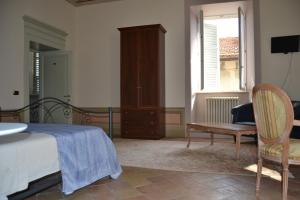 Postel nebo postele na pokoji v ubytování Palazzo Roberti