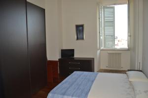 Postel nebo postele na pokoji v ubytování Palazzo Roberti