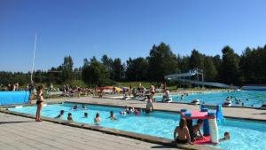 a group of people in a swimming pool at Vännäs Camping in Vännäs