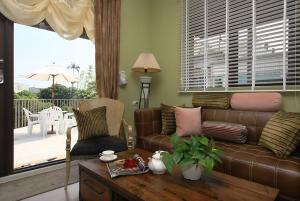 a living room with a couch and a table at D & S in Luodong