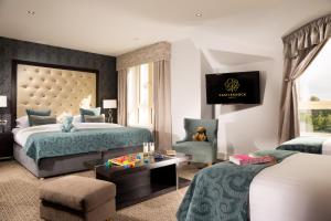 Voodi või voodid majutusasutuse Castleknock Hotel toas