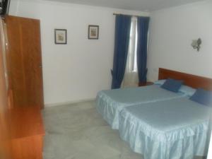 Posteľ alebo postele v izbe v ubytovaní Hostal Centro Sol