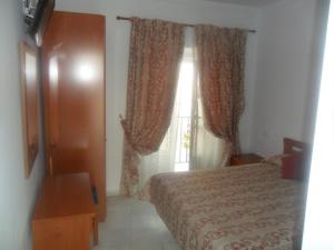 Posteľ alebo postele v izbe v ubytovaní Hostal Centro Sol