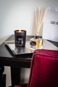 a table with two candles on top of a table at Hotel Arok in Strasbourg