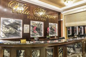 a lobby of a hotel with a reception counter at VILLA FLORENCE Boutique Apart Hotel in Sveti Vlas