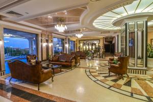 a living room with couches and chairs at VILLA FLORENCE Boutique Apart Hotel in Sveti Vlas