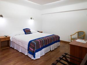 Un ou plusieurs lits dans un hébergement de l'établissement Hotel Samaña