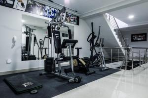 a gym with treadmills and exercise bikes in a room at Hotel El Rubi in Huaraz
