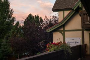 a house with a sign on the side of it at Appenzell Inn in Estes Park