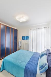 En eller flere senge i et værelse på Casetta sul mare B