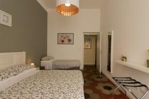 En eller flere senge i et værelse på Stazione Vaticana 5 Apartment