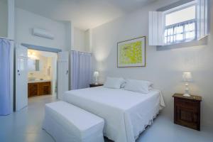 מיטה או מיטות בחדר ב-Pousada Casa de Paraty