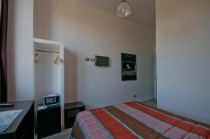 Postel nebo postele na pokoji v ubytování MF Hotel