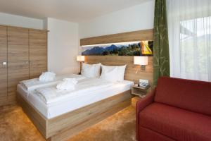 Postel nebo postele na pokoji v ubytování Ringhotel Nebelhornblick