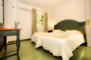 Ένα ή περισσότερα κρεβάτια σε δωμάτιο στο La Retreat +25 φωτογραφίες