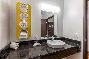 
a bathroom with a sink and a mirror at Motel 6-Las Vegas, NV - Motor Speedway in Las Vegas

