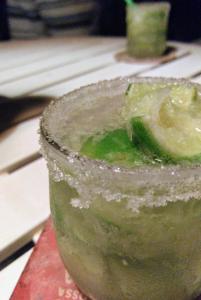 a close up of a drink with a green liquid at Bed & Breakfast Casa de Valeria in Barra Nova