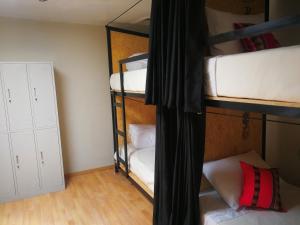 Voodi või voodid majutusasutuse Xplora Hostel Cusco toas