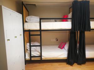 Voodi või voodid majutusasutuse Xplora Hostel Cusco toas