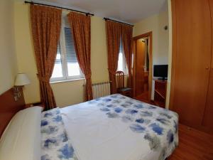 Postel nebo postele na pokoji v ubytování Hostal Prada Borges