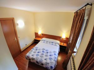 Postel nebo postele na pokoji v ubytování Hostal Prada Borges