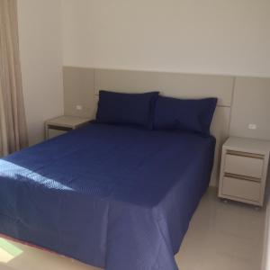 Ένα ή περισσότερα κρεβάτια σε δωμάτιο στο Palmas Paradise