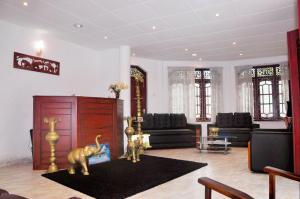 Area soggiorno di Power Zone Guest House