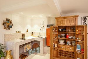 a kitchen with a large island in a room at kookaburra Down Under Coogee Beach in Sydney
