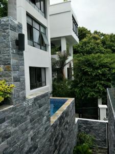 a house with a swimming pool in front of it at Nancy Bridge View A1206 in Ho Chi Minh City