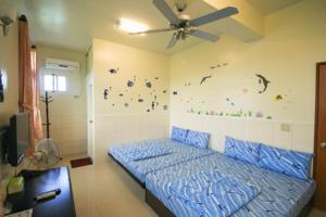 Кровать или кровати в номере HaiAn Xian Homestay