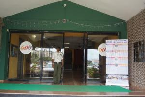 a man standing in the doorway of a building at Mapusa Residency in Mapusa