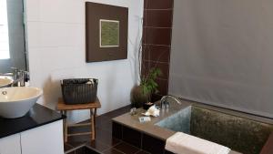 a bathroom with a sink and a sink at HI One One in Magong +46 photos