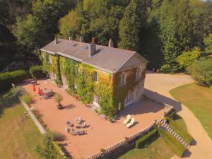 an aerial view of a house with ivy on it at Domaine de La Brugere in Nantheuil