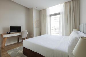 Een bed of bedden in een kamer bij Fantastay - City Walk