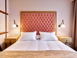Postel nebo postele na pokoji v ubytování Hotel Boutique ADOLFO