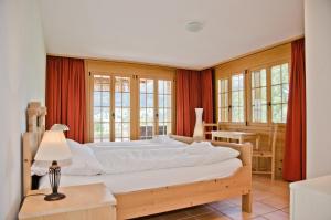 Cama o camas de una habitación en Chalet Heimat - GRIWA RENT AG