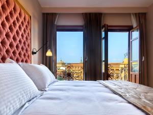 Postel nebo postele na pokoji v ubytování Hotel Boutique ADOLFO