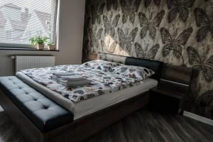 Postel nebo postele na pokoji v ubytování Apartamenty Tychy Barona