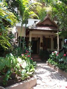 a house with a garden in front of it at Heavenly Homestay in Cochin