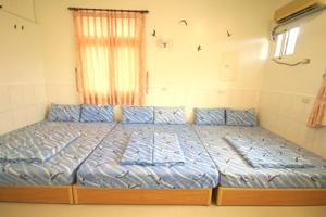 Postel nebo postele na pokoji v ubytování HaiAn Xian Homestay