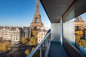 a balcony with a view of the eiffel tower at Pullman Paris Tour Eiffel in Paris