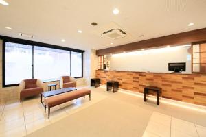 TV a/nebo společenská místnost v ubytování Smile Hotel Tokyo Ayase Ekimae
