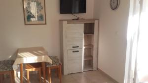 TV a/nebo společenská místnost v ubytování Apartment Dragovic