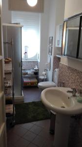 a bathroom with a sink and a toilet at La casa di Antonella in Nicolosi