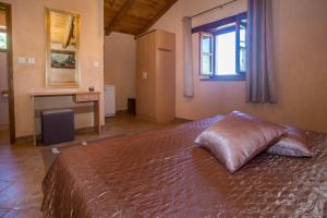 a bedroom with a large bed with a window at Holiday House Legovic in Nova Vas