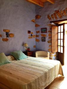 מיטה או מיטות בחדר ב-Casa yeya