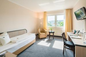 TV a/nebo společenská místnost v ubytování Best Western Hotel Am Papenberg