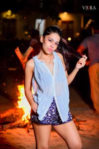 a woman is standing in front of a fire at Santon Resort & Spa - Level 1 Certified in Tangalle +71 photos